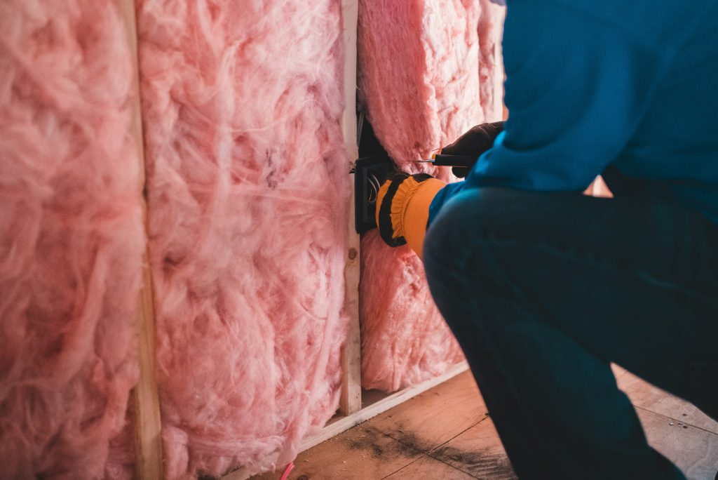 Batting insulation fitted into the studes